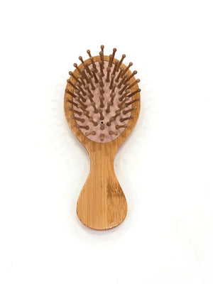 “Travel Essential” wooden hairbrush