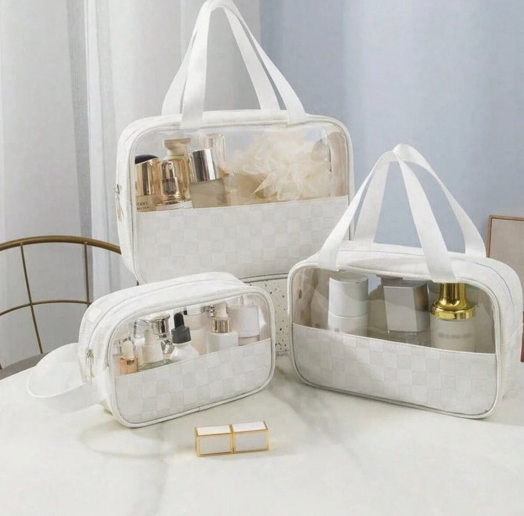 "Traveling First Class" white accessory bags