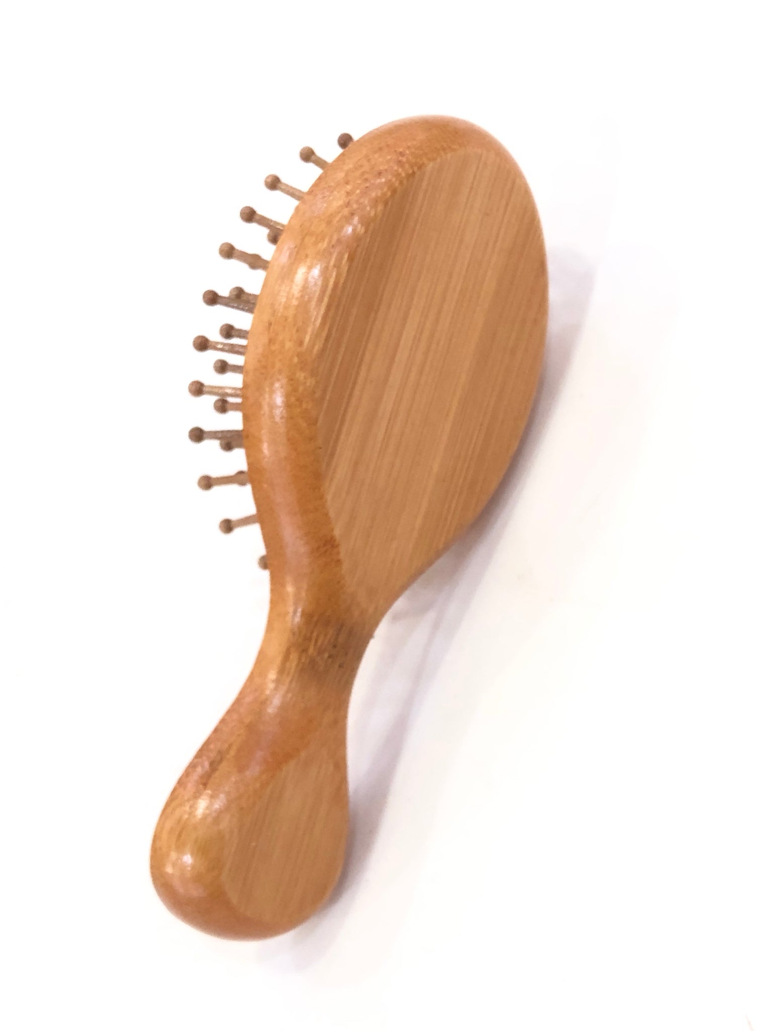 “Travel Essential” wooden hairbrush