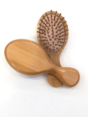 “Travel Essential” wooden hairbrush