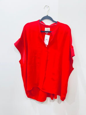 "Radiate Boldness" (red) plus top