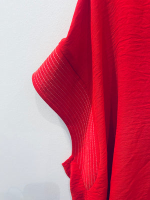"Radiate Boldness" (red) plus top