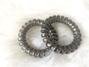 Gray non-crease hair ties.